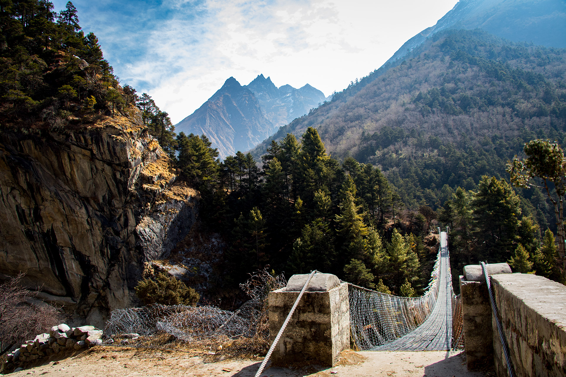 outsidematerial-nepal-ebc-everest-base-camp-trek-himalaya-suspension-brigde-mountains-sky-clouds