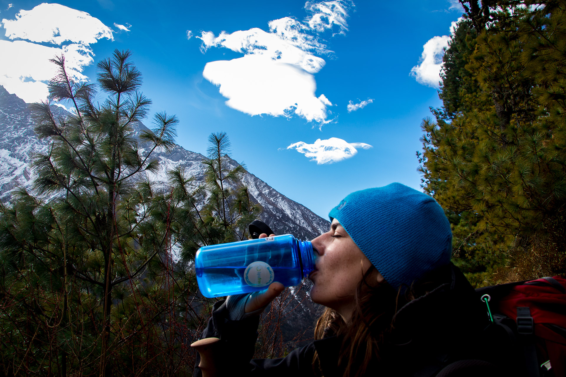 outsidematerial-nepal-ebc-everest-base-camp-trek-himalaya-water-break-girl-woman-trees