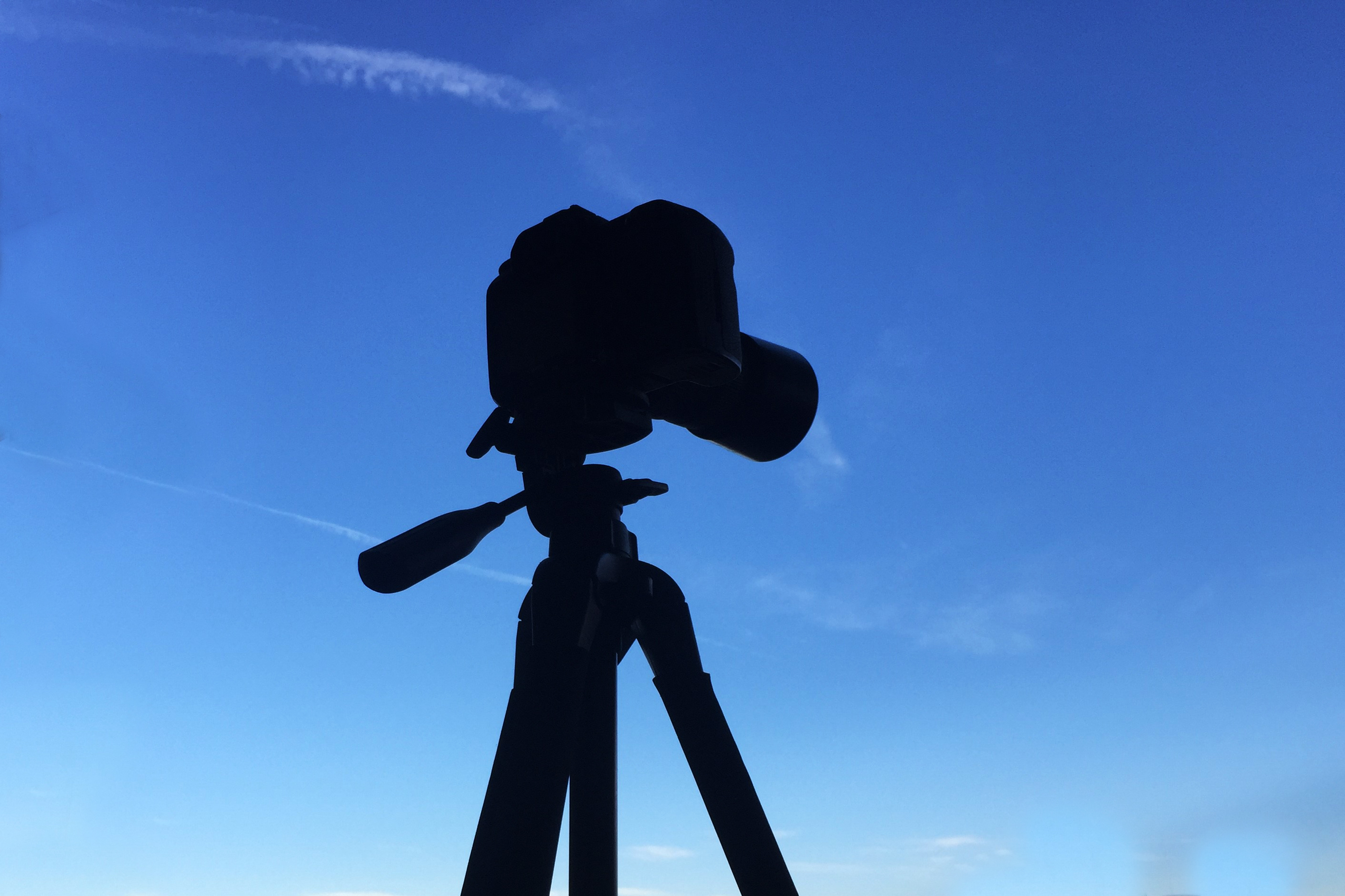 Tripod shadow with blue sky